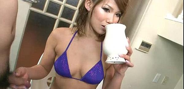  Wild and kinky Akiho sprays milk and oil o2ad8n a cock before using her feet on it